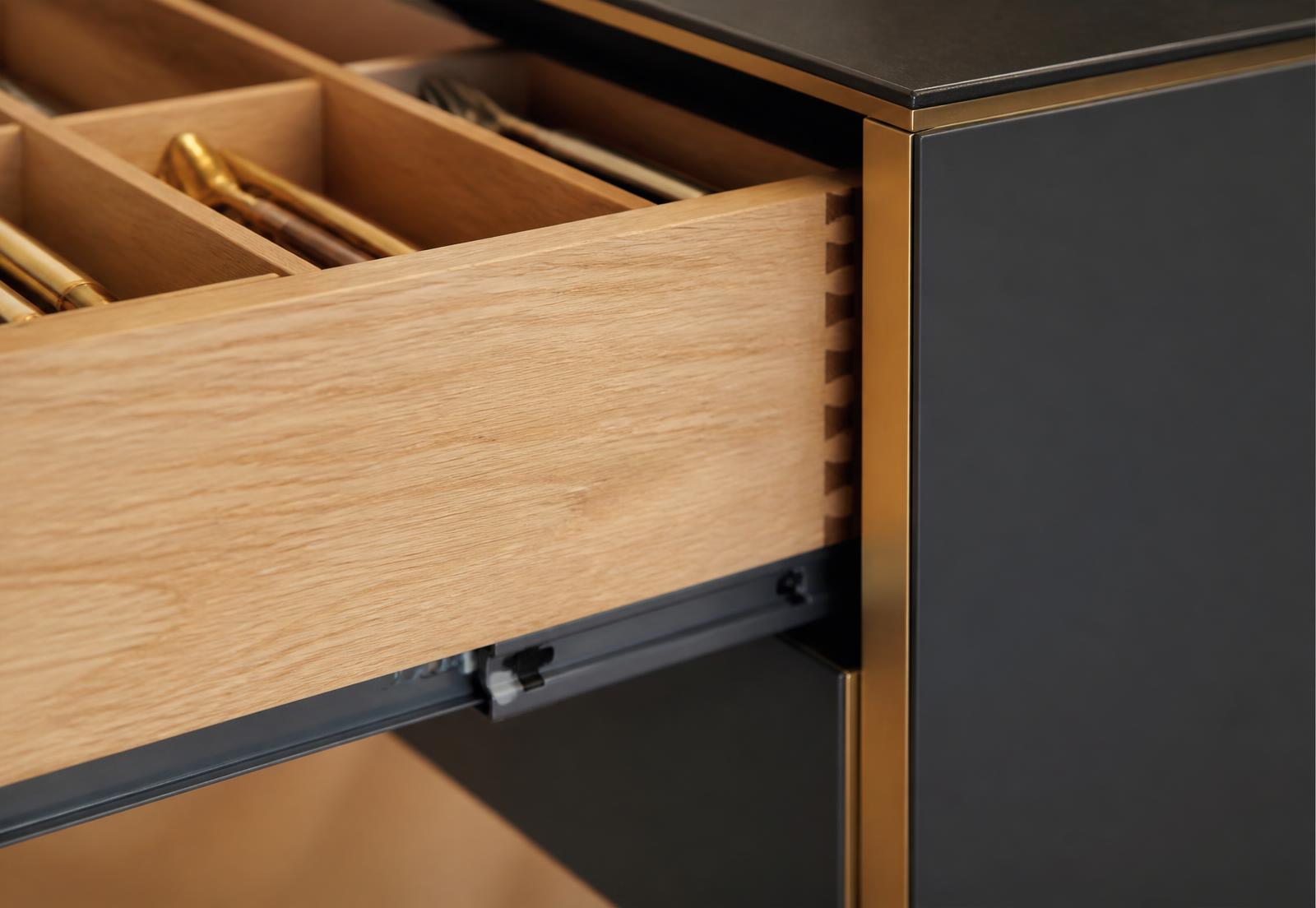Detail of dovetail drawer construction and soft-close hardware